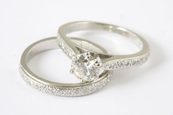 Platinum and Diamond Wedding Set: Platinum and Diamond Wedding Set set with 1 round brilliant cut diamond (.93ct, I color, SI-1 clarity), set with 32 other round brilliant cut diamonds in shank and matching band (.39ct, H-J color, VS 