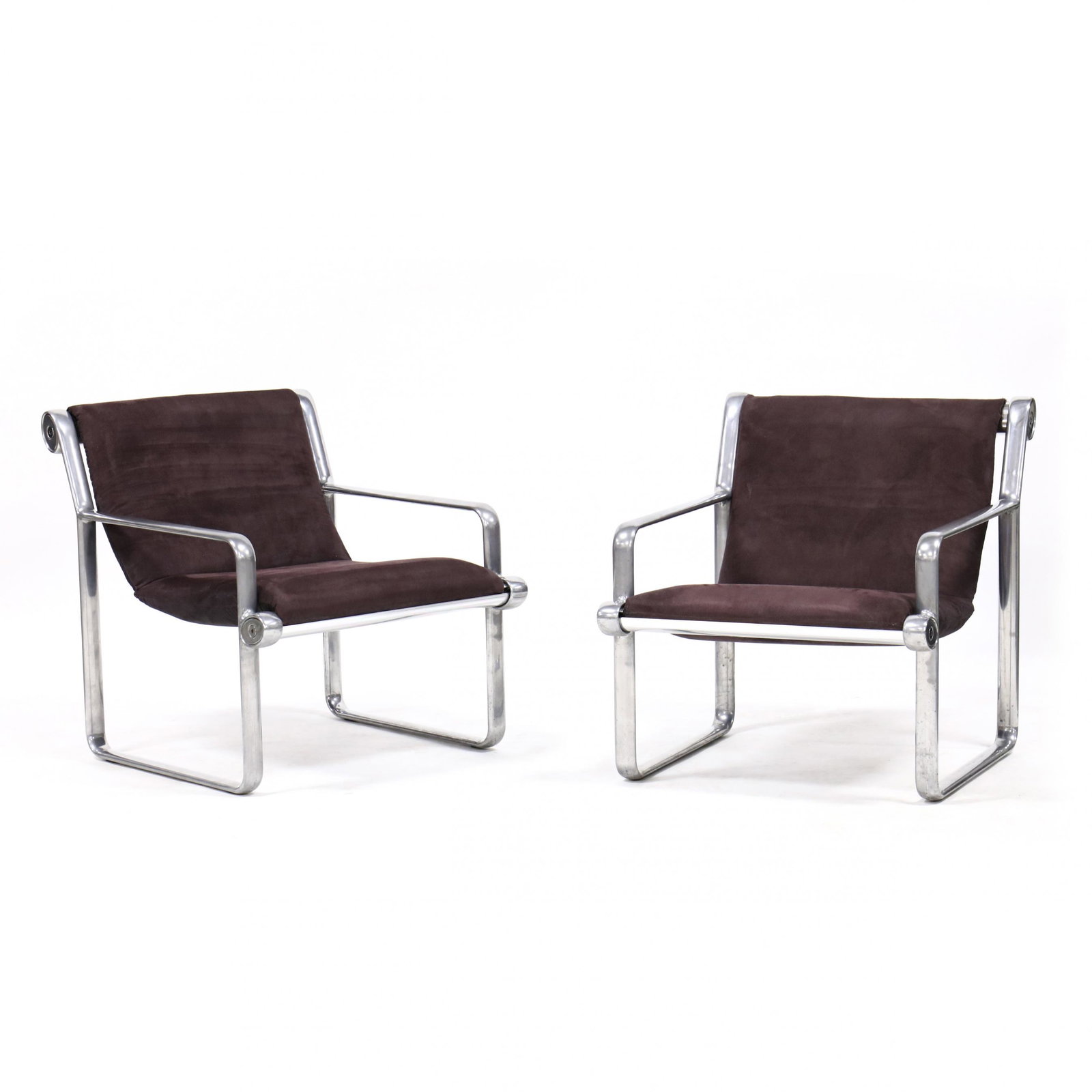 Hannah & Morrison, Pair of Sling Armchairs: Hannah & Morrison, Pair of Sling ArmchairsBruce Hannah & Andrew Morrison, Knoll, 1971, polished aluminum frame with black suede-style upholstery, labeled to underside of seat rail. 28 x 25.5 x 32 in.