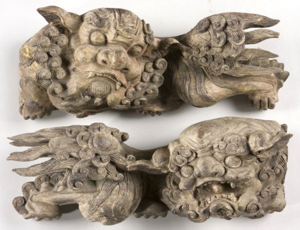 Pair of Antique Carved Wooden Foo Dogs: Pair of Antique Carved Wooden Foo Dogs Chinese, each carved from a single piece of wood and decorated with polychrome paint, one with closed mouth, the other with open mouth revealing fangs and tongue