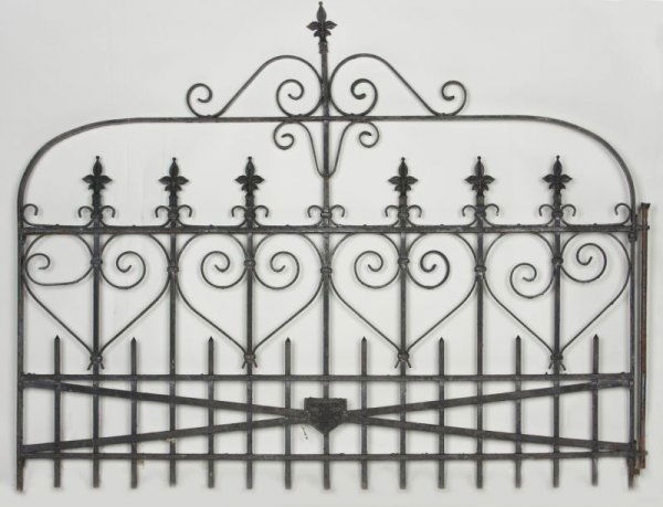 Cincinnati Iron Works Single Cast Iron Gate: Cincinnati Iron Works Single Cast Iron Gate early 20th century, black paint, fleur de lis and scroll motif, impressed on plaque at base "Cincinnati Iron Fence Co." 50 x 68 in. With expected surface we