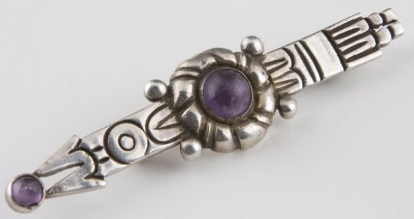 Sterling Silver Brooch by William Spratling: Sterling Silver Brooch by William Spratling in an arrow motif featuring two round cabochon amethysts; fully hallmarked. Approximately 0.55 troy ozs. with stones, 3 in. Tip of pin stem slightly bent (d