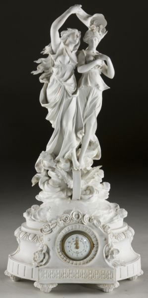 Parian Figural Shelf Clock: Parian Figural Shelf Clock late 19th century, Continental, (2) maidens with flowing hair and gowns surmount a clock set within a floral garland, raised on fluted feet. 25 x 12 x 8 in. Restoration to t
