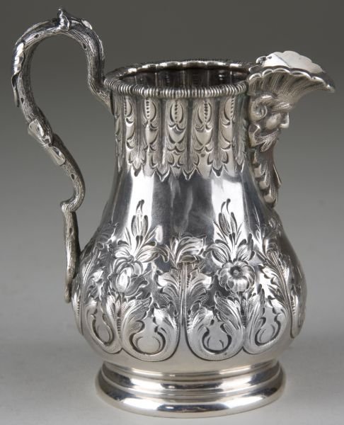 Grosjean & Woodward Silver Cream Jug: Grosjean & Woodward Silver Cream Jug retailed by Hayden Brother & Co. of Charleston, SC; circa 1855-1860, ornately decorated in high style with chased floral and foliate decoration to body and mask fo
