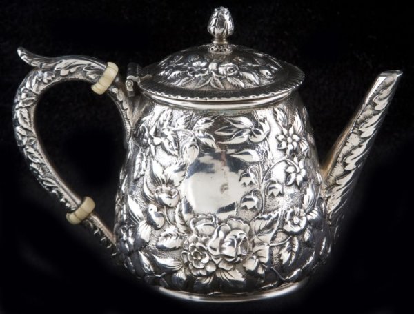 S. Kirk & Son Coin Silver Jug & Cover: S. Kirk & Son Coin Silver Jug & Cover the gently tapering body with allover floral repousse design which is also repeated on the lid, cast handle, and cast spout, ivory spacers to handle indicate that