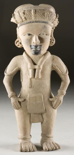 Pre-Coumbian Veracrauz Pottery Figure: Pre-Coumbian Veracrauz Pottery Figure Mexico, circa 600 - 900 A.D., the subject stands with hands at hips wearing a headdress, bracelets, anklets and a decorative cord. Black paint accents on the face