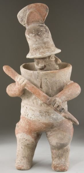 Pre-Columbian Nayarit Pottery Warrior: Pre-Columbian Nayarit Pottery Warrior Mexico, 3rd century B.C. - 3rd century A.D., the figure, assuming an aggressive posture, wears a crested helmet and is clad in barrel armor; substantial amounts o