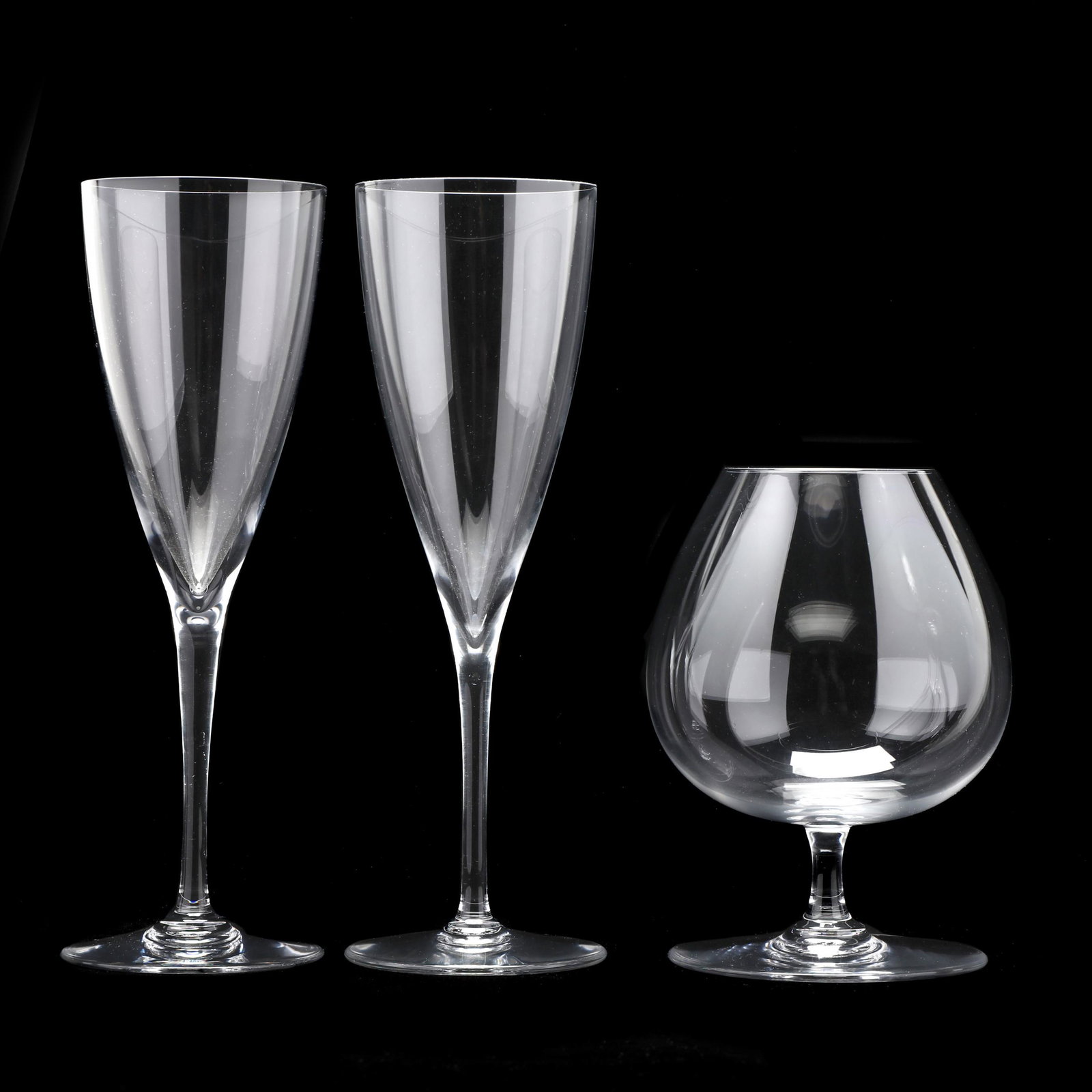 Baccarat, A Grouping of Three Crystal Stems: Baccarat, A Grouping of Three Crystal StemsFrance, to include a pair of Dom Perignon water goblets (8 7/8 in.), and a DÃ©gustation Cognac Snifter (5 3/4 in.), all marked to undersides. Private Colle