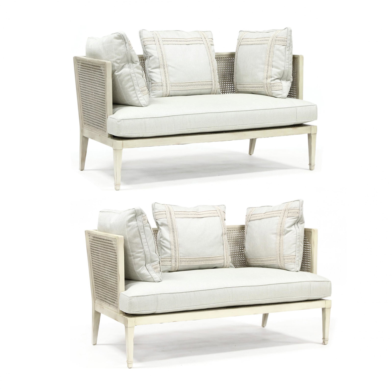 Contemporary Pair of French Cane Settees: Contemporary Pair of French Cane Setteescustom built with an antiqued cream paint, double cane frame, each with three down filled pillows, single loose cushion on square tapered legs, unmarked. 31.5 x