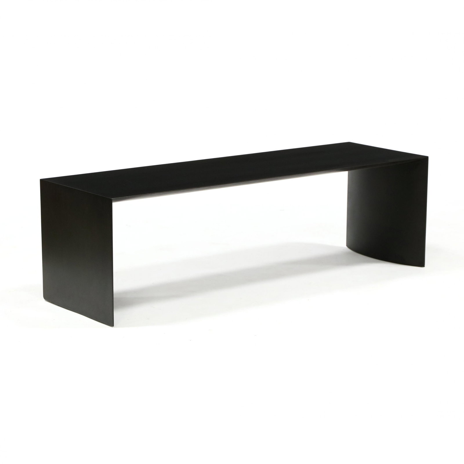 Giulio Lazotti (Italian, b.1942), Bench: Giulio Lazotti (Italian, b.1942), Bench Italy, designed 2001, ebonized wood veneer, flat exterior with curved interior panels, marked Cumin, Made in Italy to underside of feet. 17.5 x 57.5 x 18.25 in.