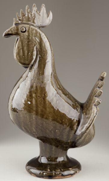 Edwin Meaders GA Folk Pottery Rooster: Edwin Meaders GA Folk Pottery Rooster light khaki alkaline glaze, left facing with bulbous body, signed on the bottom "Edwin Meaders 6-9-1993." 15.5 in. Base underside with original kiln malformation;