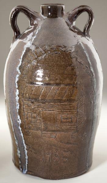 Chester Hewell GA Folk Pottery Syrup Jug: Chester Hewell GA Folk Pottery Syrup Jug double handled form approximately 3 gallons, with soda glass drips from the handles, likely milk of magnesia glass glaze for decoration, whimsically inscribed 