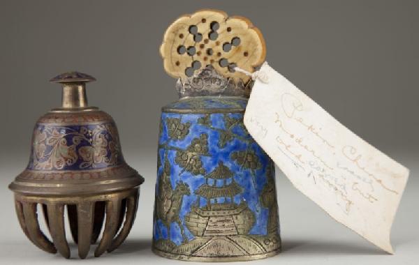 Two Antique Chinese Bells: Two Antique Chinese Bells the first, (4.25 in.), being enameled bronze with figural decoration, a pierced ivory handle and a green glass clapper. The top of the handle is carved with a Chinese charact