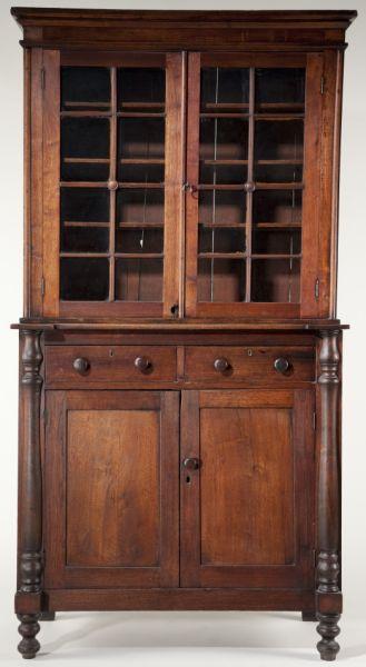 Southern Jackson Press: Southern Jackson Press circa 1840, walnut with yellow pine and poplar secondary woods, (2) part form, having a stepped cornice over (2) doors each with (8) lights divided by reeded mullions. The botto
