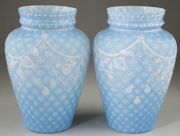 Pair of Thomas Webb Satin Glass Vases: Pair of Thomas Webb Satin Glass Vases unsigned but attributed to Webb, England, 1885-1925, blue quilted satin glass, tapered form having a high collar with applied enamel floral swags. 10 in. Original