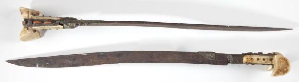 Pair of Ottoman Turkish Yataghan Swords: Pair of Ottoman Turkish Yataghan Swords 18th -19th century, brass mounted walrus ivory grips inset with coral, steel blades etched with likely Koran verse and maker's name. Blade 22.25 in. ; LOA 27.25