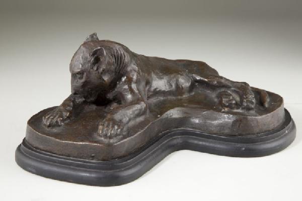Charles C. Rumsey (NY, 1873 - 1922), Bronze Puma: Charles C. Rumsey (NY, 1873 - 1922), Bronze Puma signed "C. C. Rumsey" behind the recumbent cat's tail; marked "Roman Bronze Works N. Y." on the lower rear side; the casting rests on a fitted wooden b