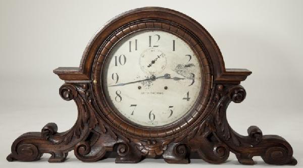 Rare Seth Thomas 30-Day Shelf Clock: Rare Seth Thomas 30-Day Shelf Clock time and strike movement, painted tin dial marked "Seth Thomas / Thirty Day / Made in U.S.A." with subsidiary seconds dial, in arch-topped stained oak case carved w