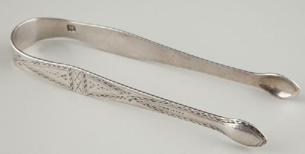 Hester Bateman Sterling Silver Sugar Tongs: Hester Bateman Sterling Silver Sugar Tongs with bold maker's mark, fine bright-cut engraving, monogram in the 18th century style "IDM," no date letter. 5.25 in. 1.3 troy ozs. Private Collection of a M