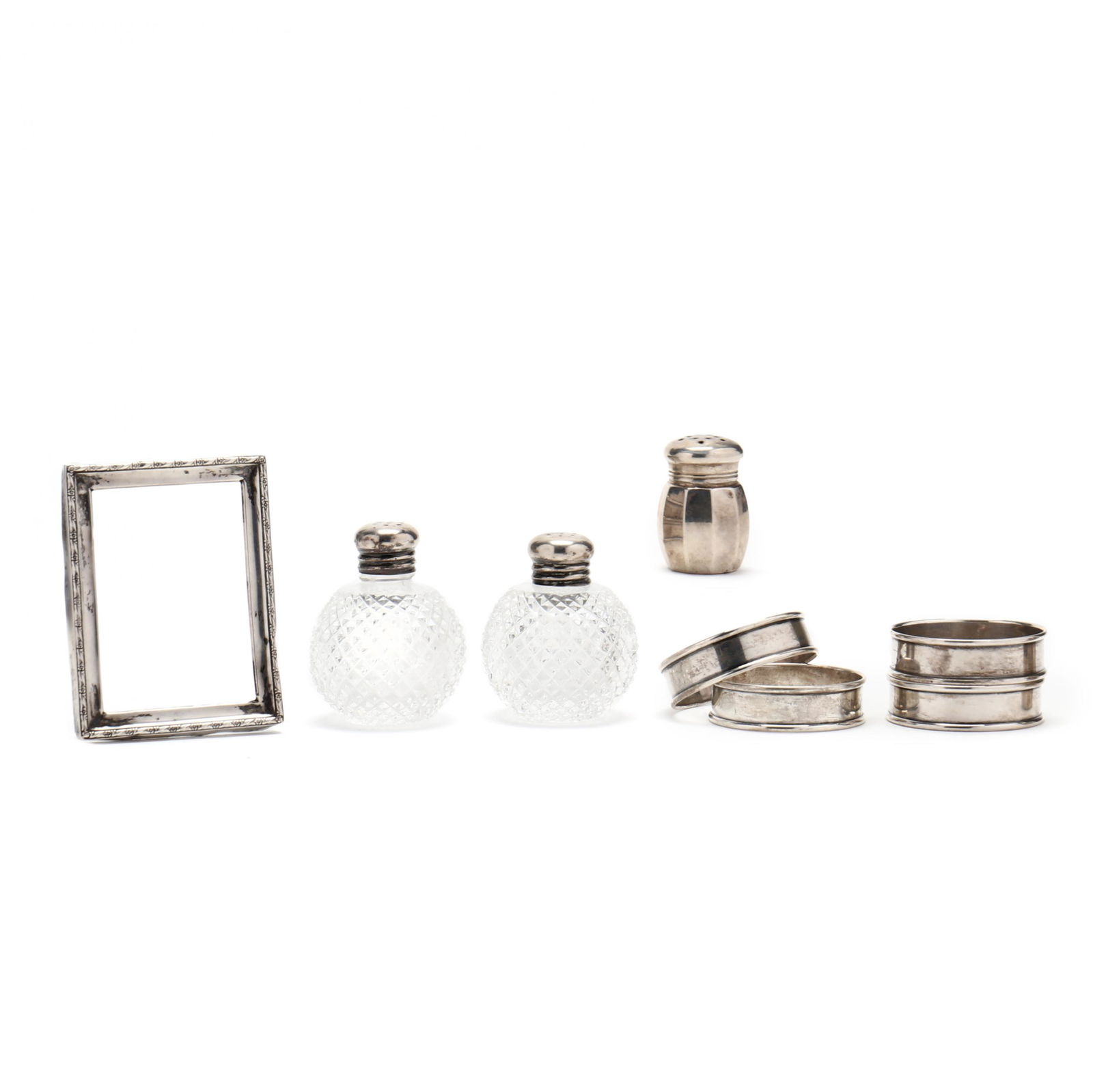A Grouping of Sterling Silver Table Accessories: A Grouping of Sterling Silver Table Accessoriesto include: (4) Gorham napkin rings, all model number 6290; Empire Silver Co. small sterling silver salt shaker with lined interior (1 1/2 in.); Webster