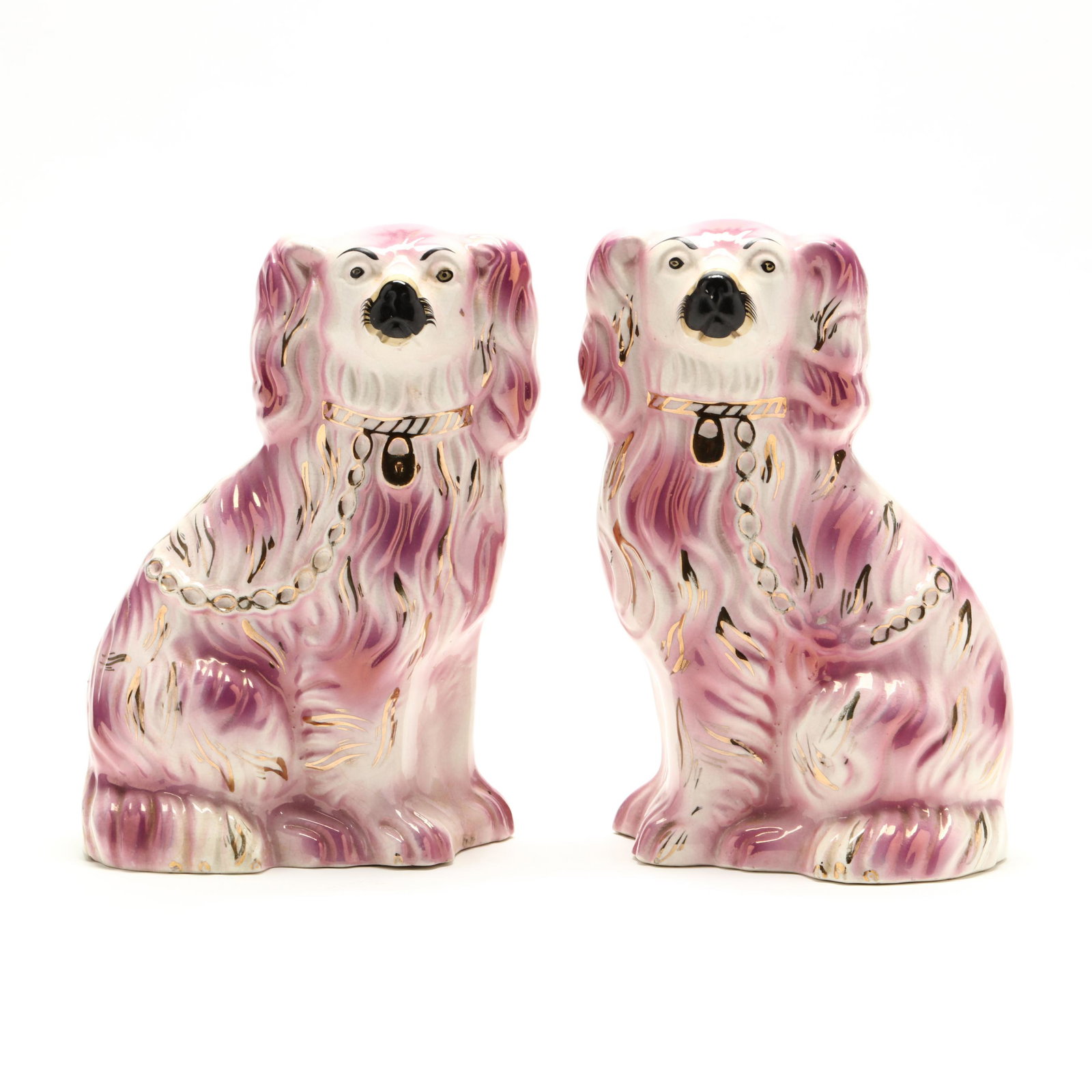 Pair of Staffordshire Spaniels: Pair of Staffordshire Spaniels 20th century, painted in rose tones with gold luster detail, ink stamped on the underside. 9 in. From the Collection of Mary Bryan Griswold Smith, Greensboro, North Caro