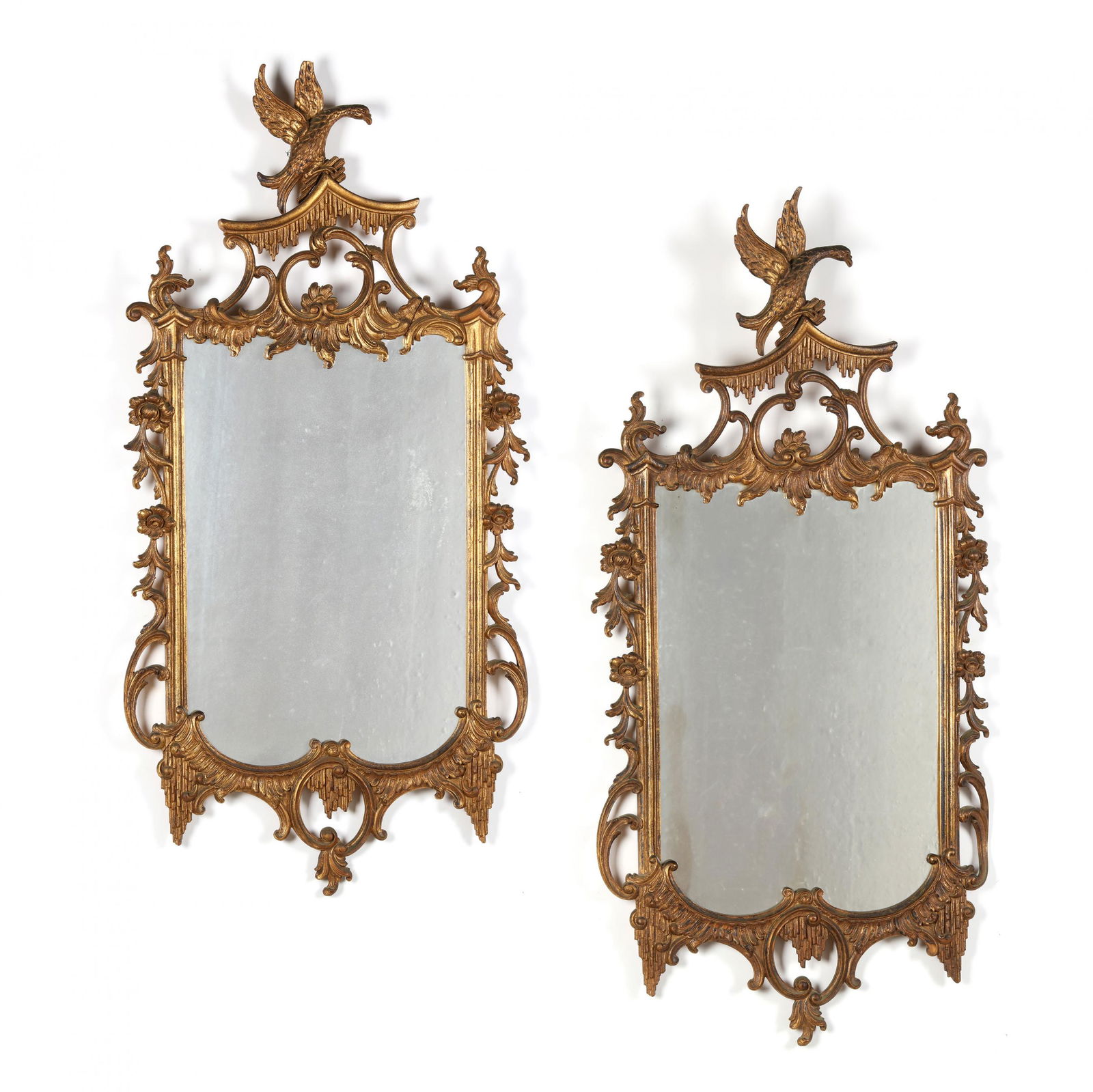 Pair of Chinese Chippendale Style Gilt Mirrors: Pair of Chinese Chippendale Style Gilt Mirrorsmid 20th century, gilt composition with an antiqued surface, antique mirrors, the pierced frames with spread winged birds over scrollwork and floral motif