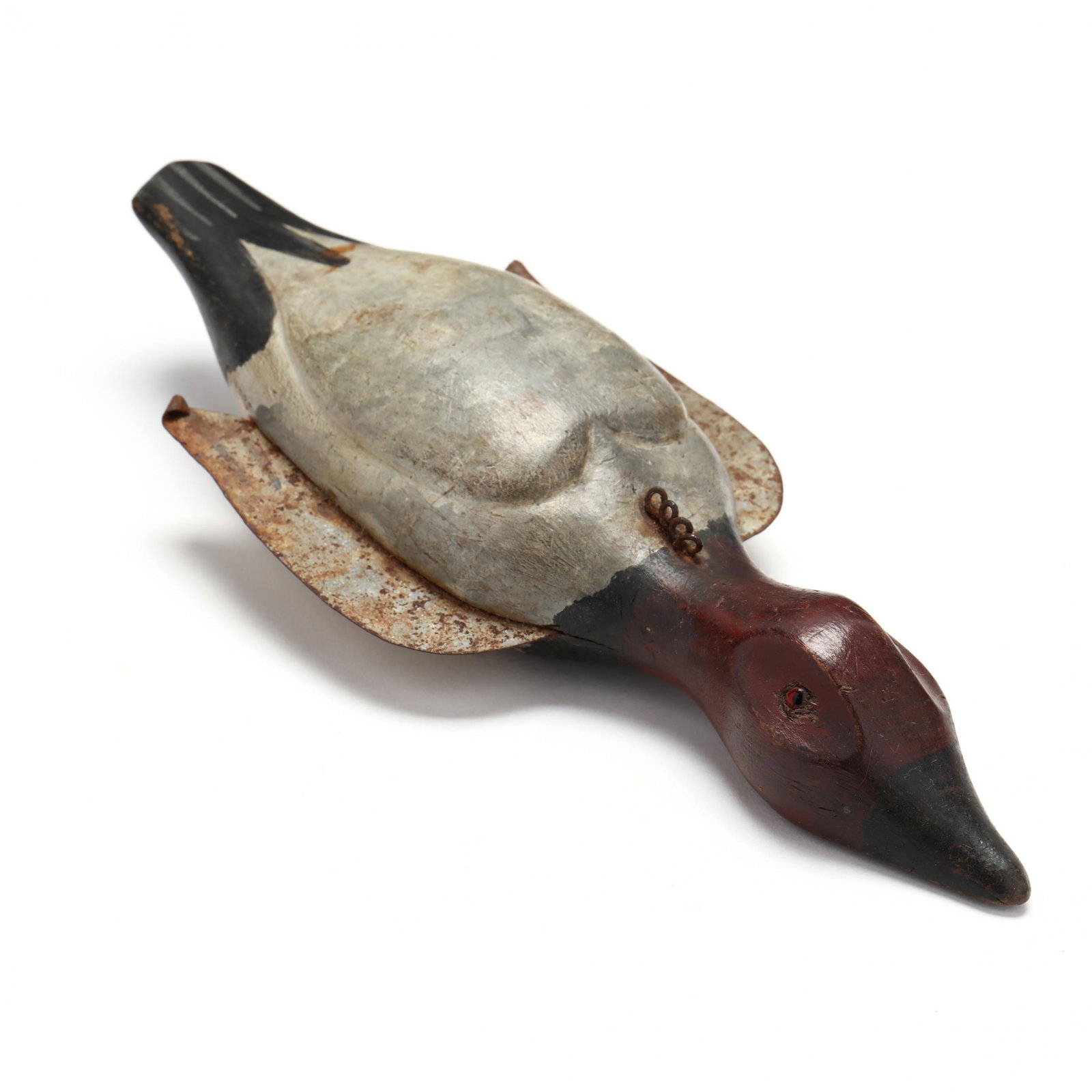 Canvasback Spear Fishing Decoy: Canvasback Spear Fishing Decoy first quarter 20th century, an extremely rare spear fishing decoy probably made and hunted in Minnesota. It is an honest working decoy. Length 11 in. Additional high-res