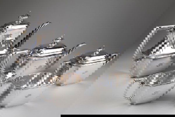 Tiffany & Co. Sterling Coffee and Tea Service: Tiffany & Co. Sterling Coffee and Tea Service circa 1920, classic Art Deco form with monogram "NPB" on each piece, five piece service including: coffee pot (8.5 in.), teapot, creamer, covered sugar, a