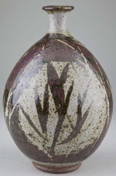 Peter Voulkos (Am., 1924-2002), Bottle Vase: Peter Voulkos (Am., 1924-2002), Bottle Vase a bulbous form vase with tapered neck. A rust colored glaze adorns a grey and green speckled field. Signed "Voulkos" to the underside of the base. This is a