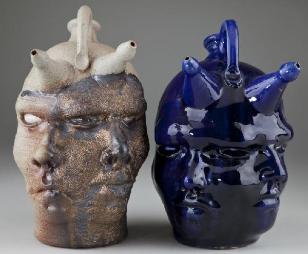 Peter Lenzo Two Face Jugs: Peter Lenzo Two Face Jugs South Carolina pottery, contemporary, self -portrait twins, the first is stoneware with a partial metallic glaze, inscribed "Lenzo #4 10-19-2002"; the second is stoneware wit