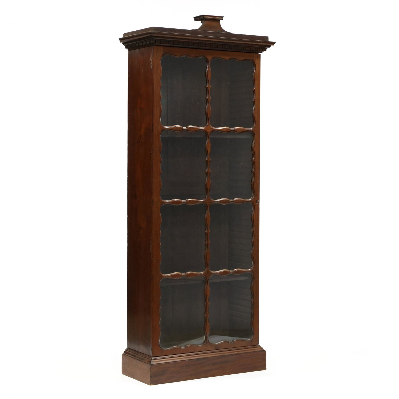 George III Mahogany Bookcase: George III Mahogany Bookcase circa 1800, oak secondary, removable stepped pediment with dentil molding, single glazed door with eight individual panels with shaped and molded surrounds, louvered shelf