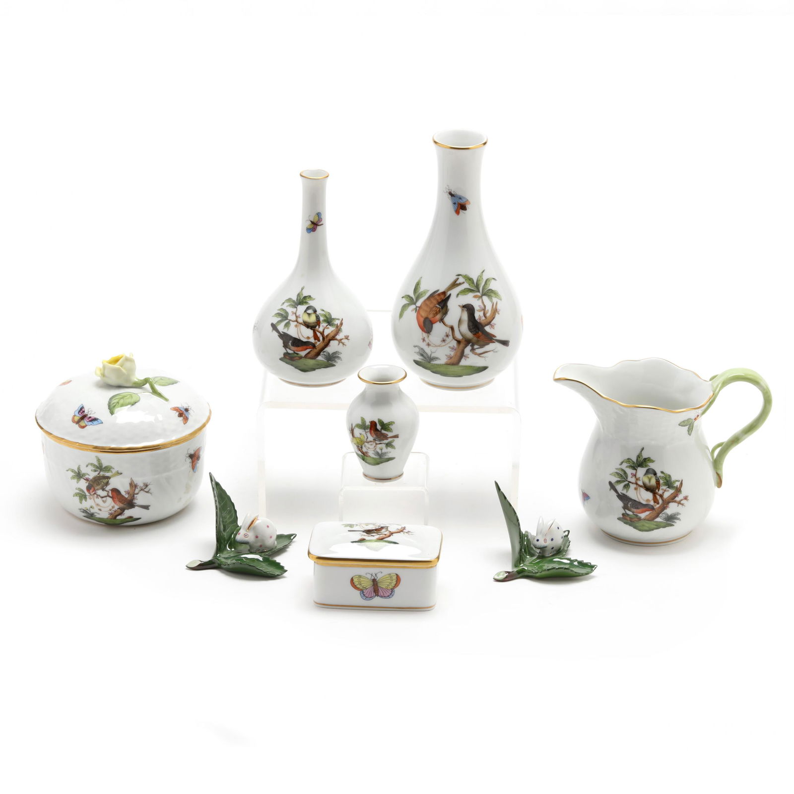 A Grouping of Eight Herend Porcelain Table Accessories: A Grouping of Eight Herend Porcelain Table Accessoriesto include: a covered sugar; a cream jug #1642 (4 in.); two place card holders in the form of bunnies on leaves; a trinket box #7876; two bud vase
