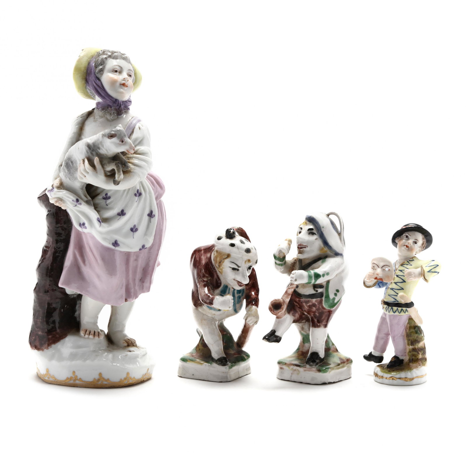 Four Antique Porcelain Figurines: Four Antique Porcelain Figurines The first is in the manner of Meissen, a girl carrying a lamb, (6.75in.) (chip to hat; loss of lamb's foot; girl's head re-glued); two 19th century French faience figu