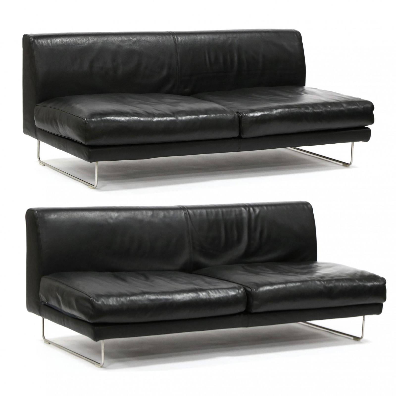 Jasper Morrison (England, b.1959), Pair of Elan: Jasper Morrison (England, b.1959), Pair of Elan Leather Armless Sofasdesigned 1999, black Italian leather velcro upholstery, each with deep seats having two loose down-mix seat cushions, polished stee