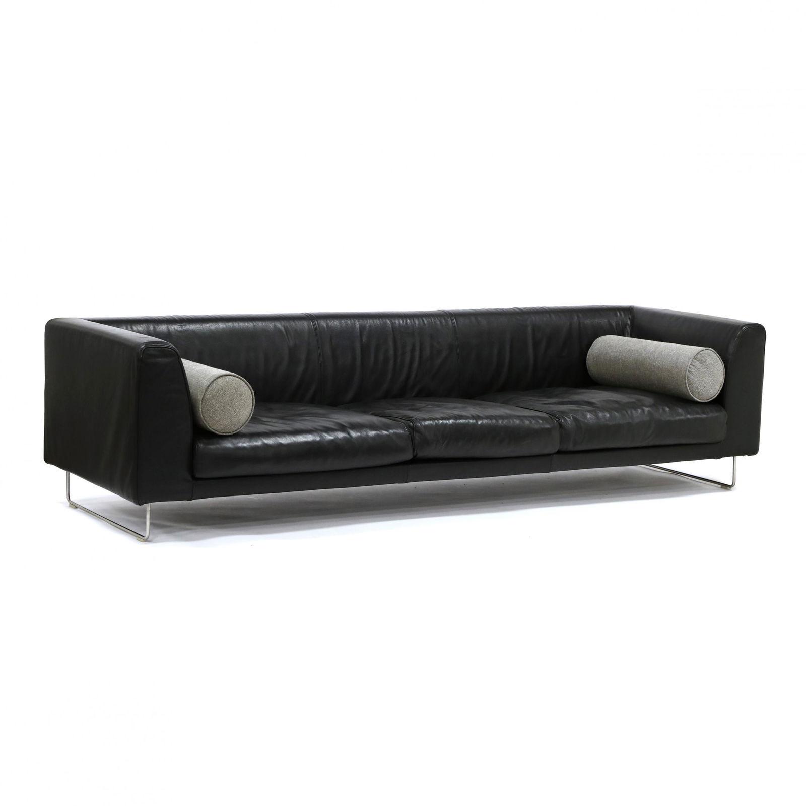 Jasper Morrison (England, b.1959), Elan Leather Sofa: Jasper Morrison (England, b.1959), Elan Leather Sofadesigned 1999, black Italian leather velcro covered frame, deep seat with three loose down-mix cushions, pair of grey bolster pillows, steel rod leg