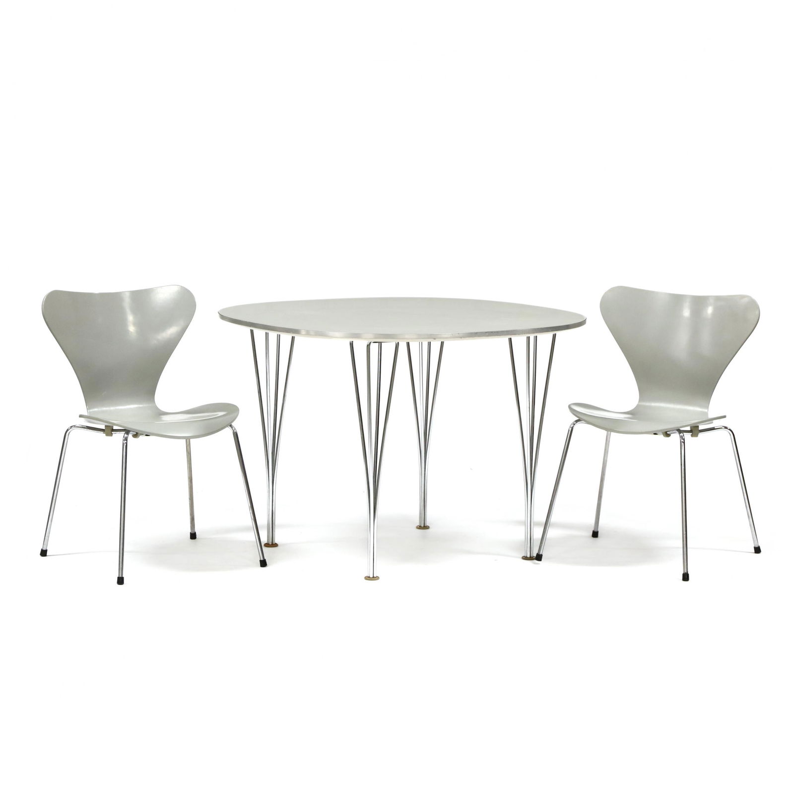 Fritz Hansen Table and Two Chairs: Fritz Hansen Table and Two Chairs1990 manufacture, including a white laminate and steel table designed by Piet Hein & Bruno Mathsson (28.75 x 39.5 x 39.5 in.); and a pair of Series 7 grey painted bent