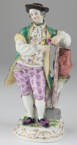 Meissen Porcelain Figurine of a Gardener: Meissen Porcelain Figurine of a Gardener holding a nosegay, a shovel and watering can to his left, bottom marked with crossed swords with pommel as well as impressed "125," painter mark "53" and inscr