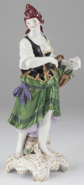 Porcelain Figurine Marked KPM: Porcelain Figurine Marked KPM (Royal Porcelain Factory Berlin), portrays a peasant girl carrying a basket and holding a mug spilling milk, raised on a Rococo style arched and gilt accented base. Botto