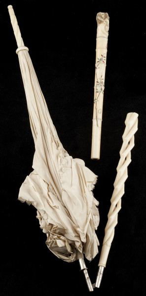 Two Ivory Cane Handles, 19th century: Two Ivory Cane Handles, 19th century the first likely Japanese, Meiji period, the terminal with carved monkeys, the shaft with inlaid branch with berries and bugs (small split to shaft, several inlaid
