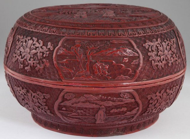 Chinese Large Cinnabar Covered Circular Box: Chinese Large Cinnabar Covered Circular Box Qing dynasty, 19th century or early 20th century, the flattened top finely carved in high relief with a scene of a scholar and his attendant on a pavilion w