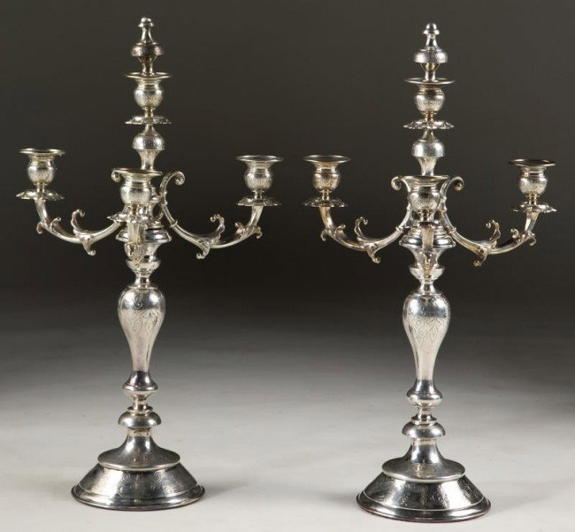 Pair of Silver Candelabra, late 19th century: Pair of Silver Candelabra, late 19th century Austrian hallmarks and with "CS" maker's mark, three arm form with finial for central candleholder, the arms are removable, allover foliate and strapwork e