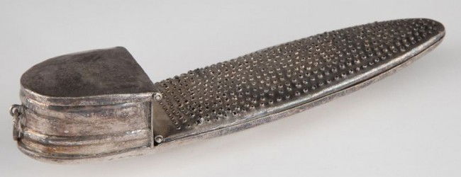 Silver Nutmeg Grater, 19th century: Silver Nutmeg Grater, 19th century unmarked, hammer marks throughout, oblong form with hinged grating cover comprising two thirds of the length, a deep box on the end with hinged cover for holding the