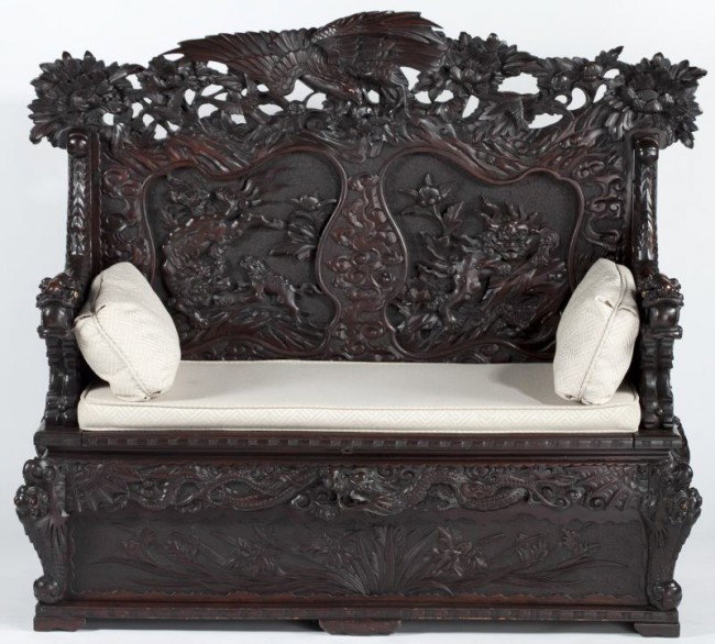 Antique Chinese Blackwood Settee: Antique Chinese Blackwood Settee late 19th - early 20th century, heavily carved throughout, the crest of the tall back is dominated by a large bird of prey, below which are two inset panels featuring 