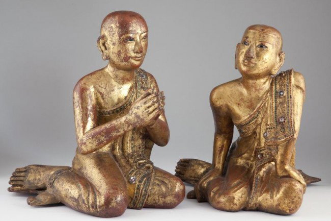 Pair of Burmese Gilt Lacquered Buddhist Monks: Pair of Burmese Gilt Lacquered Buddhist Monks Mandalay Period, 19th century, both figures with all over red-brown lacquer and gilt, the borders of their robes decorated with glass inlays. 12 in. The C