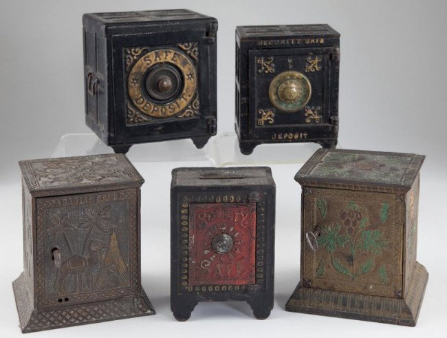 Group of Five Cast Iron Safe Banks: Group of Five Cast Iron Safe Banks the group includes a safe by Henry Chart Mfg. Co. Detroit, Michigan, Pat. May 12, 1885 (5.25 in.) closed with unknown combination; a key lock safe with polychrome fl