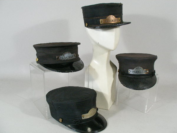 Four Vintage Atlantic Coast Railroad Hats,: Group of Four Atlantic Coast Railroad Hats, a mid 19th c. flagman, black silk, very worn; a 1940s conductor hat, black silk (silk faded, sweatband resewn); and 1950s station master, black silk; and a