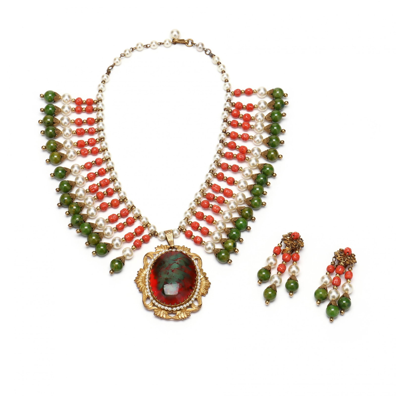 Egyptian Revival Style Suite, Miriam Haskell: Egyptian Revival Style Suite, Miriam Haskell 1970s, featuring a a fringe of faux pearl, coral and jade centered with a large seed pearl and gilt metal mounted oval glass pendant, the design based on t