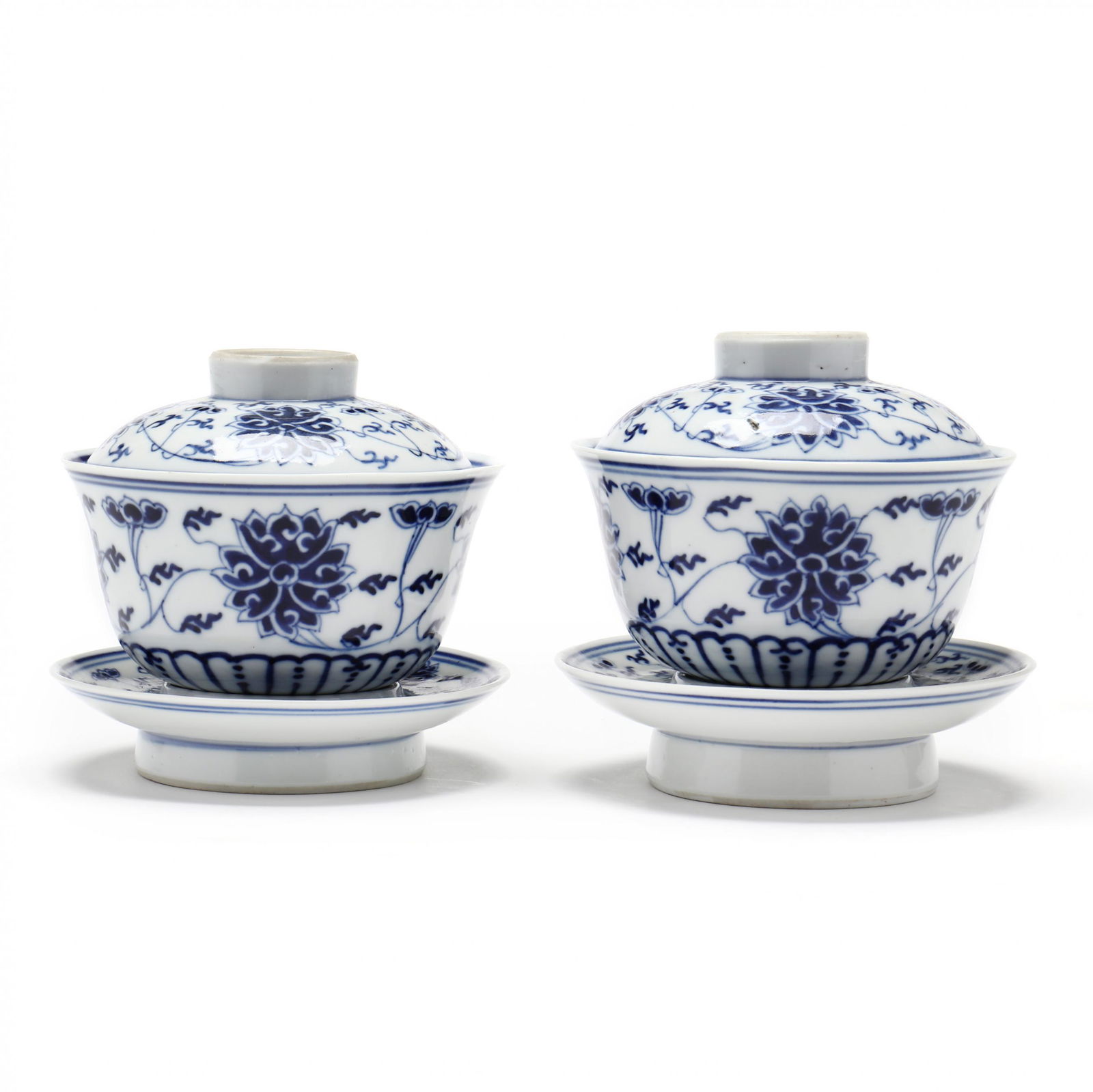 A Pair of Chinese Blue and White Lotus Covered Bowls on Cup Stands (1 of 8)