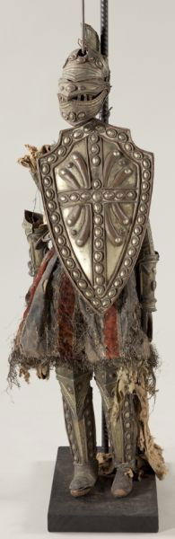 Antique Italian or Sicilian Rod Puppet: Antique Italian or Sicilian Rod Puppet late 19th century, depicts a knight in full armor of beaten copper embellished with brass-toned paint, a velvet skirt interwoven with metallic threads is at the