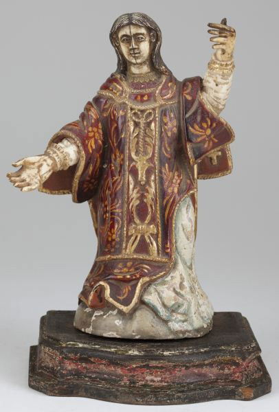 Carved Polychrome and Gesso Santos: Carved Polychrome and Gesso Santos circa 18th century, likely Spanish Colonial, depicts a robed female with slightly over-sized hands, affixed by pegs to a stepped wooden base. 8.5 in Collection of Mr
