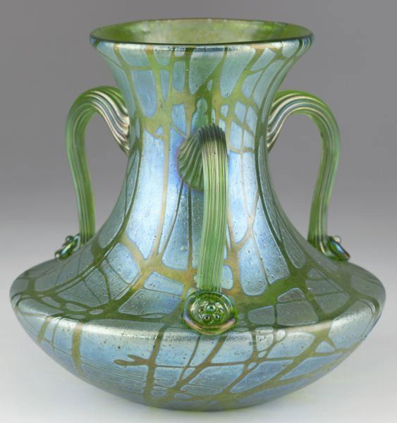 att. Loetz Art Glass Pampas Vase: att. Loetz Art Glass Pampas Vase circa 1890s, light green with iridescent "mother-of-pearl" luster, three handle form, the ribbed and scrolled handles terminating in decorative blossom form mounts, un